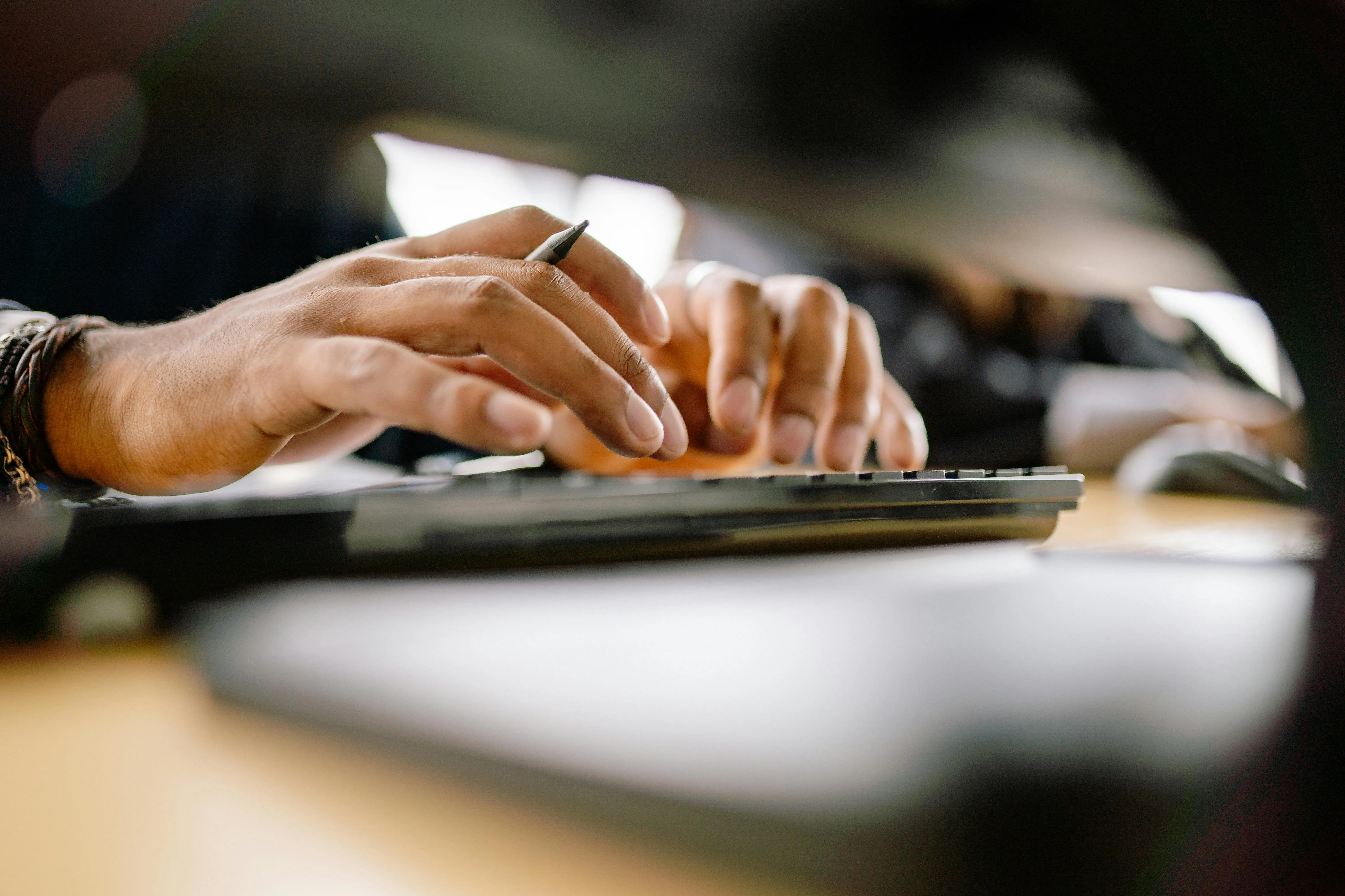 User typing on keyboard